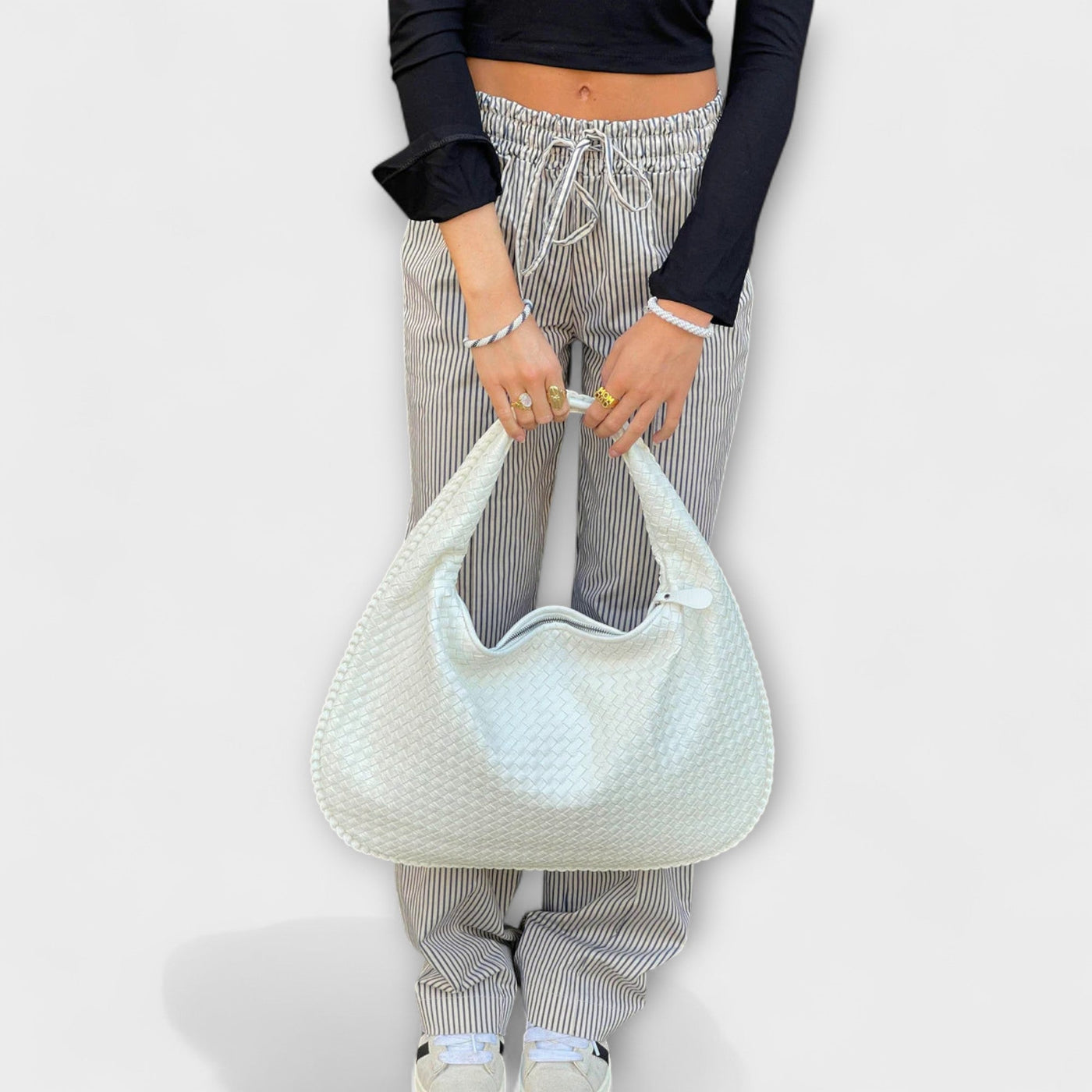 Cristina – Bolso de mano trenzado y moderno